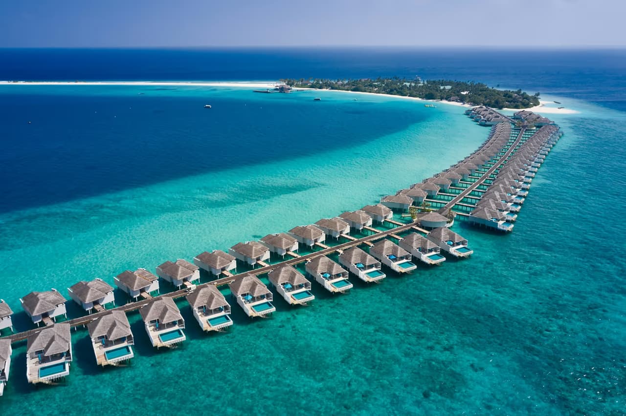 Overwater villas beside the sandbank, aerial view at Finolhu