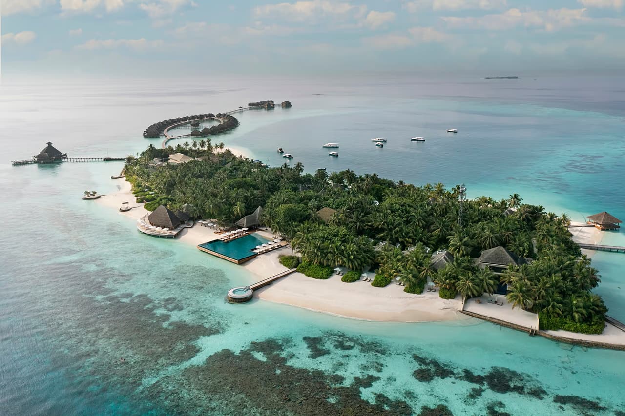 Island and reef, aerial view at Huvafen Fushi