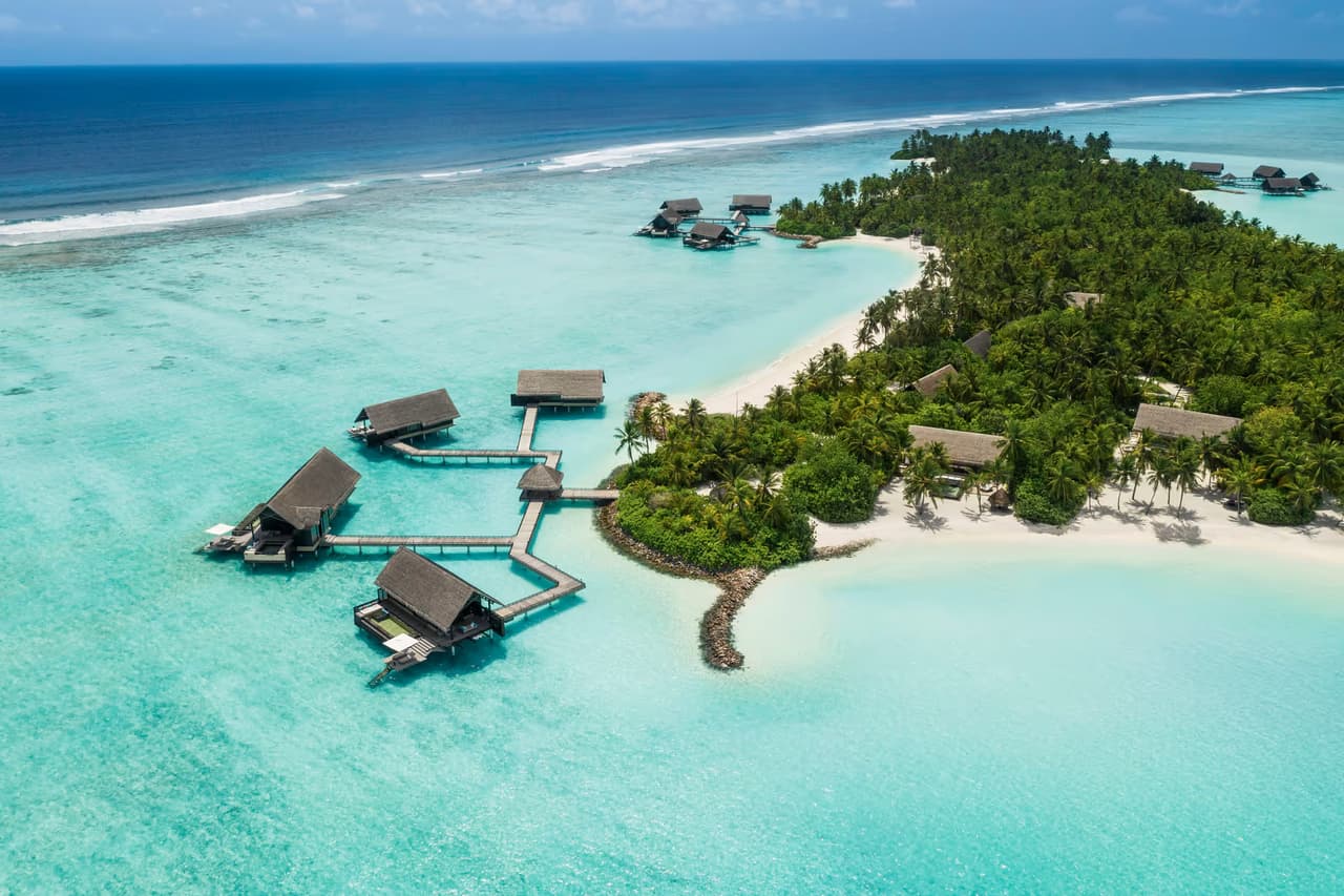Island shoreline and overwater villas, aerial view at One&Only Reethi Rah