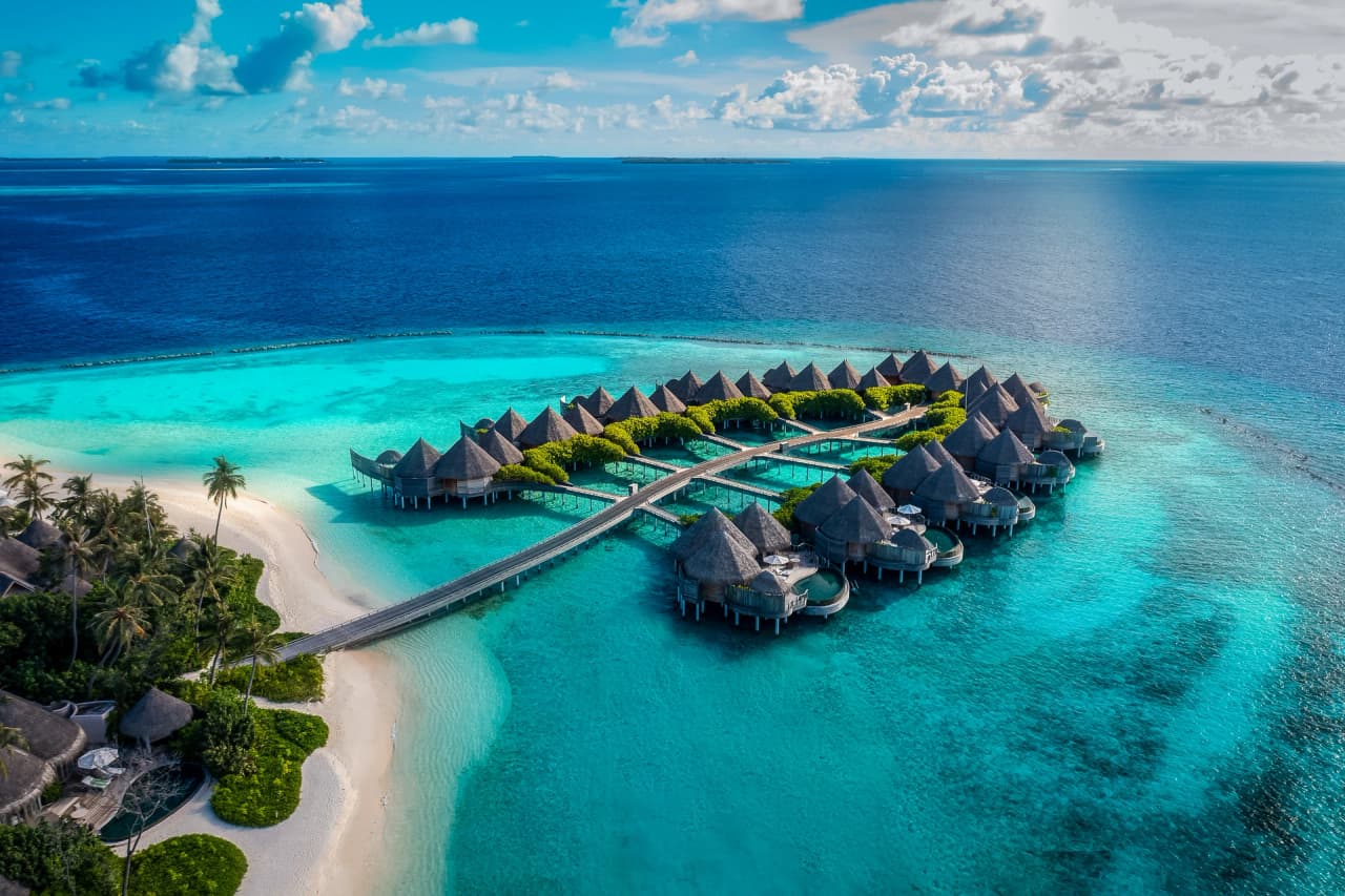 Island and water houses, aerial view at The Nautilus Maldives