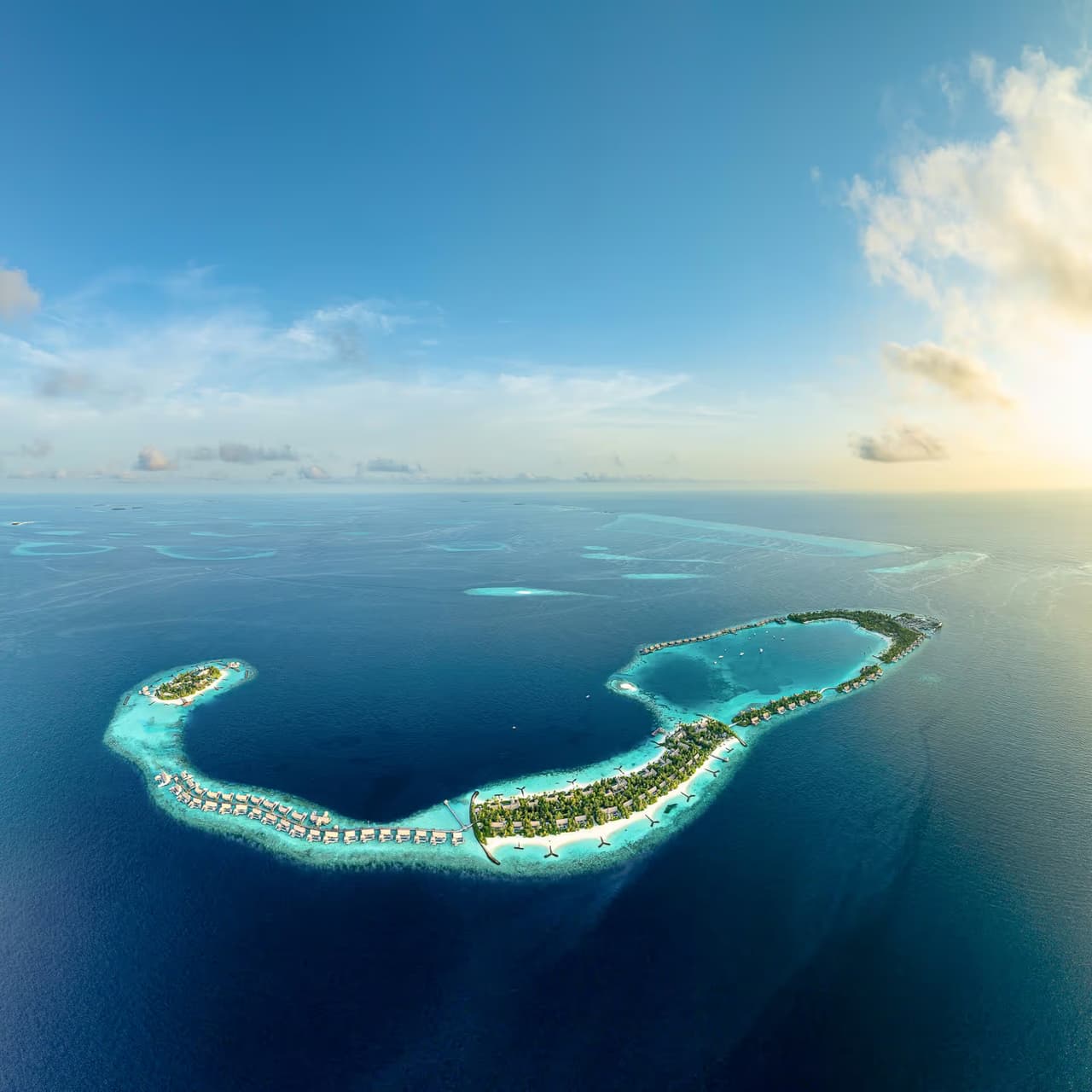 Island chain and reef, aerial view at Waldorf Astoria Maldives Ithaafushi