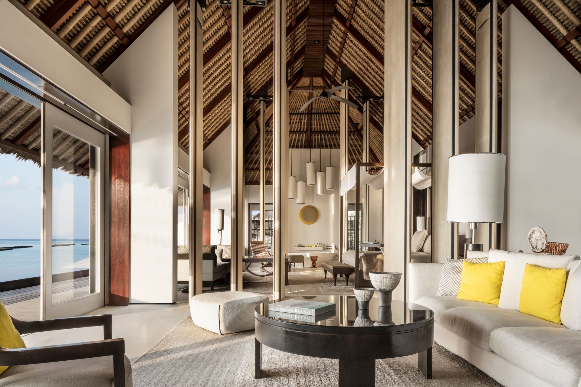 Water villa living room with vaulted ceiling at Cheval Blanc Randheli