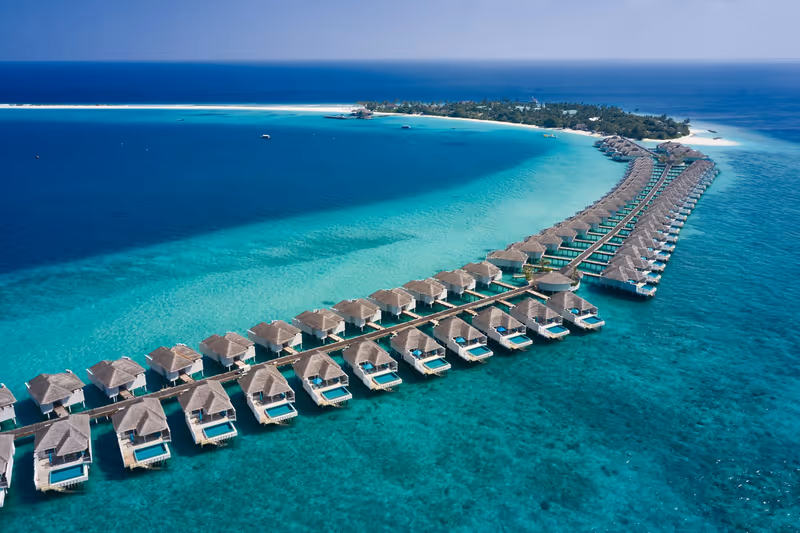 Overwater villas beside the sandbank, aerial view at Finolhu