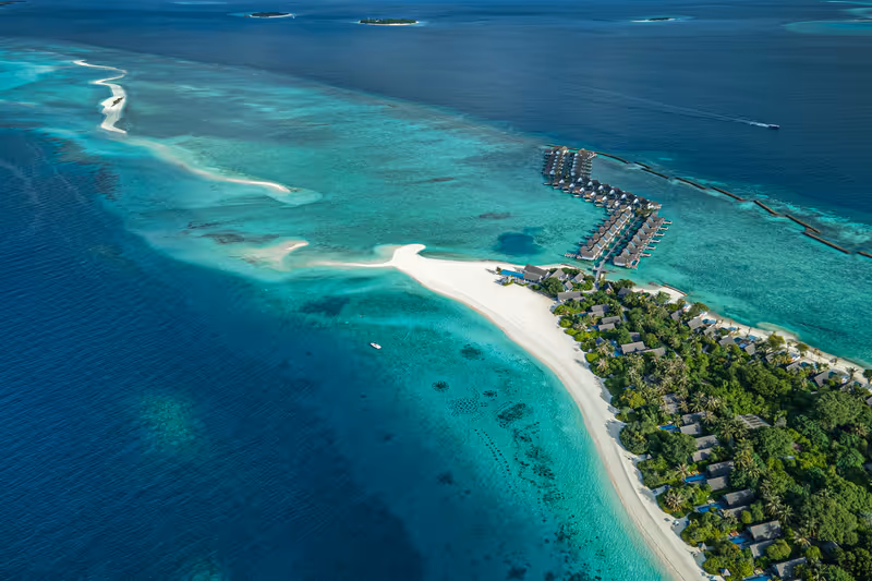 Island and long sandbank, aerial view at Four Seasons Landaa Giraavaru