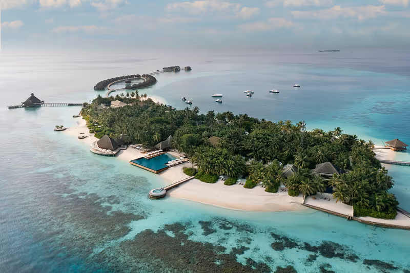 Island and reef, aerial view at Huvafen Fushi