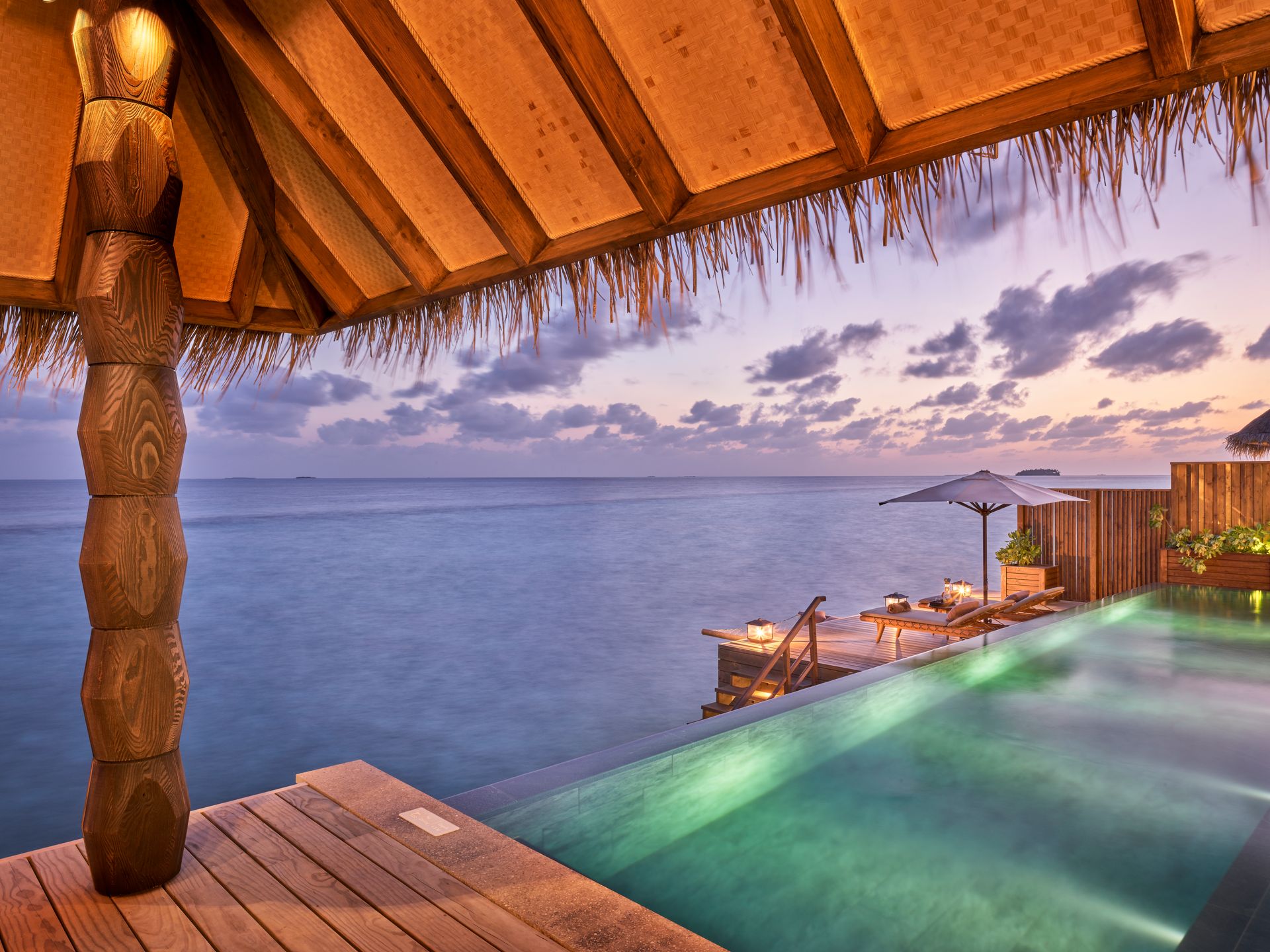 Water villa pool overlooking the sunset at Joali Maldives