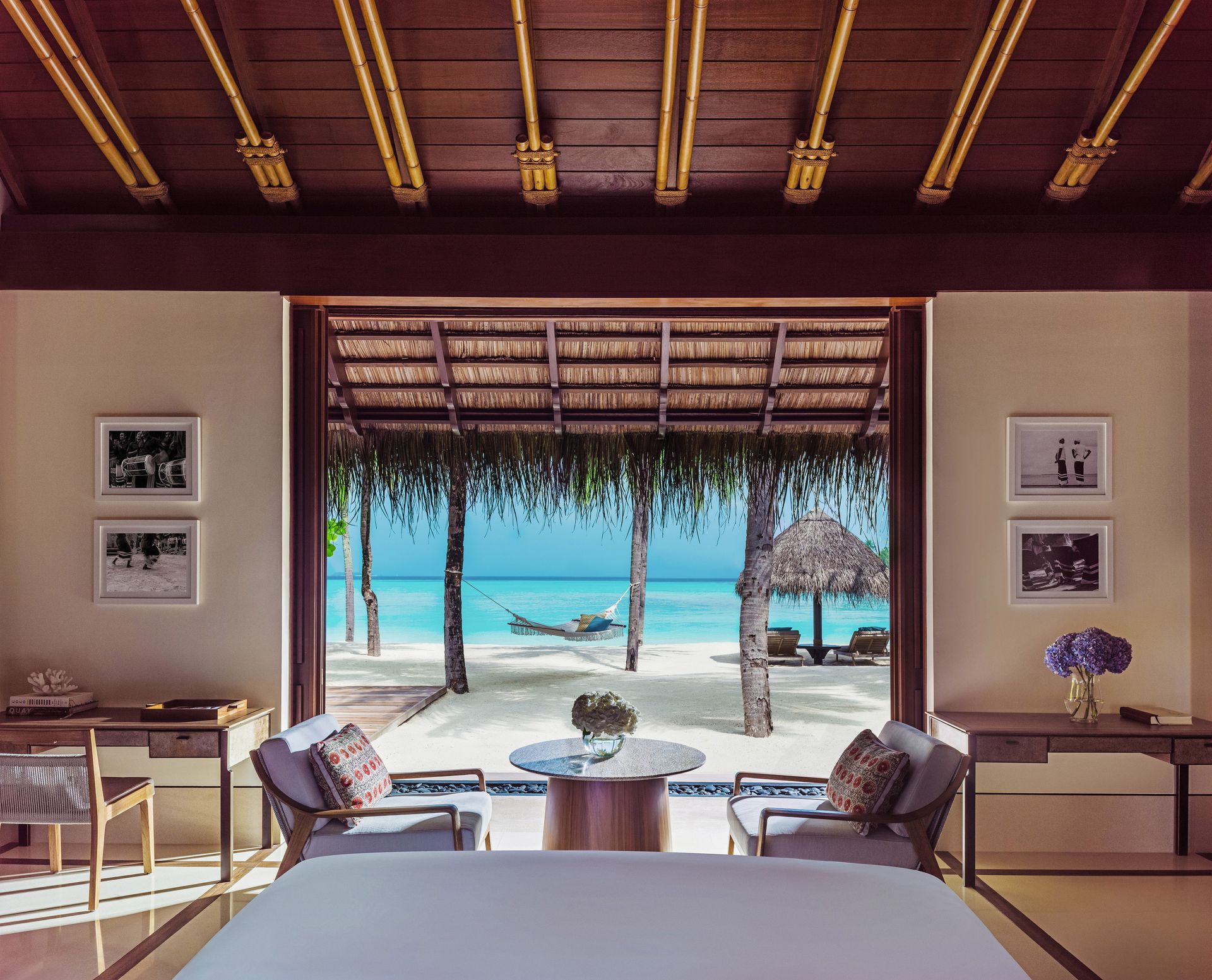 Water villa bedroom overlooking the lagoon at One&Only Reethi Rah