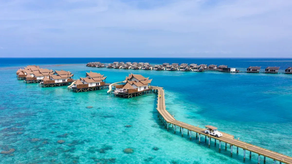 Overwater villas and jetty, aerial view at Ozen Reserve Bolifushi