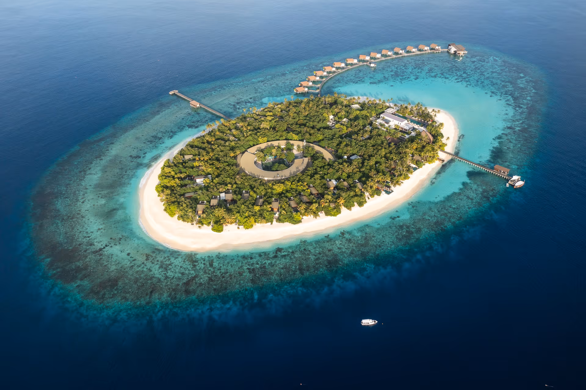 Island and surrounding coral reef, aerial view at Park Hyatt Hadahaa