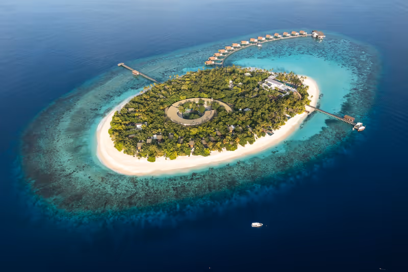 Island and surrounding coral reef, aerial view at Park Hyatt Hadahaa