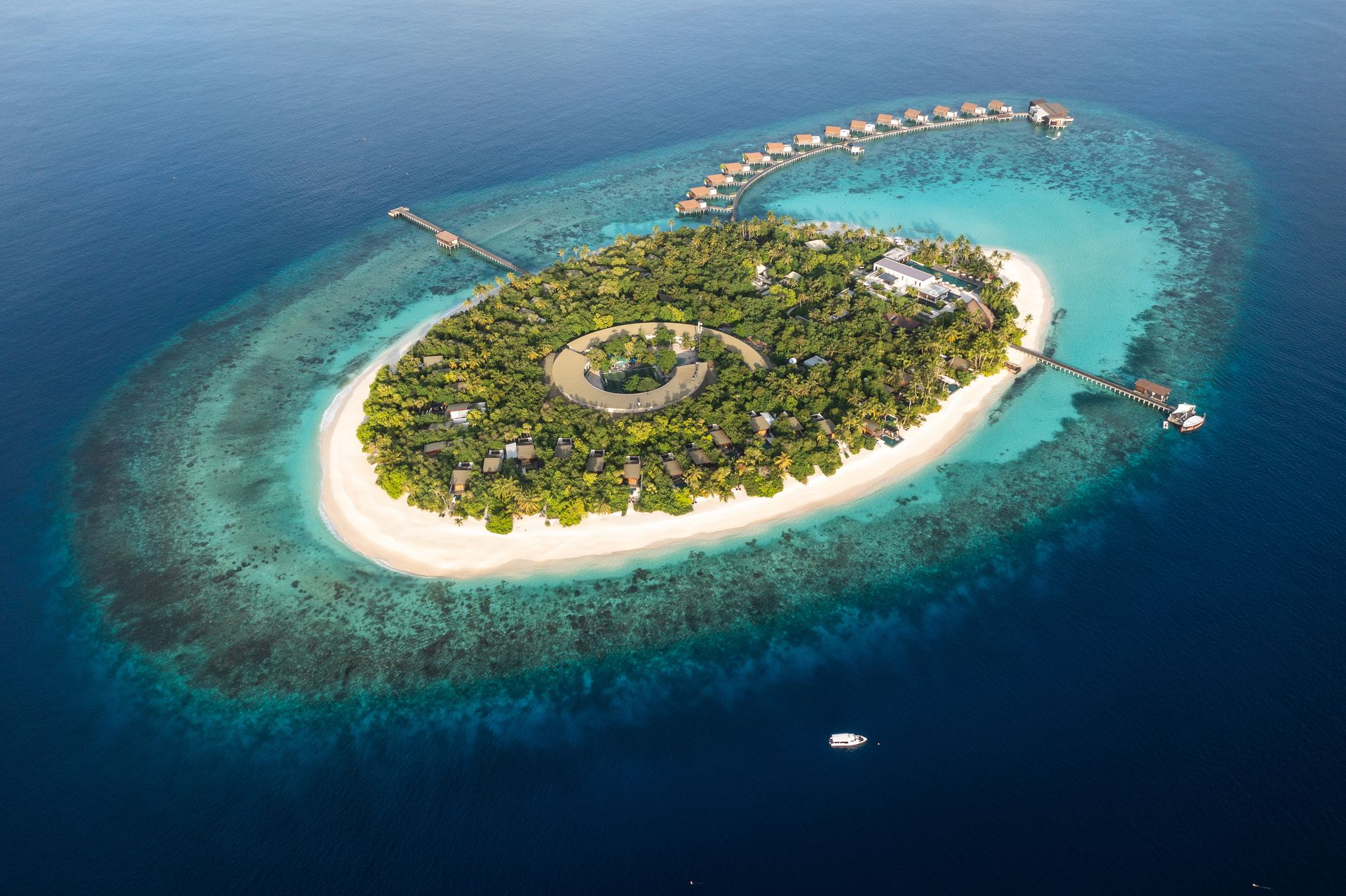 Island and surrounding coral reef, aerial view at Park Hyatt Hadahaa