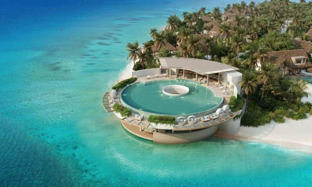 Circular beachfront pool, aerial view at Six Senses Kanuhura