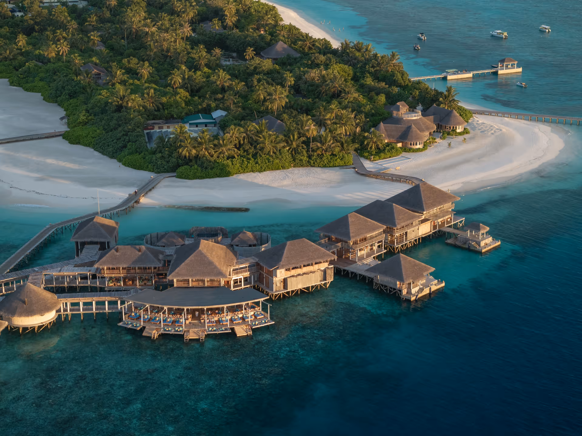 Island and overwater restaurant, aerial view at Six Senses Laamu