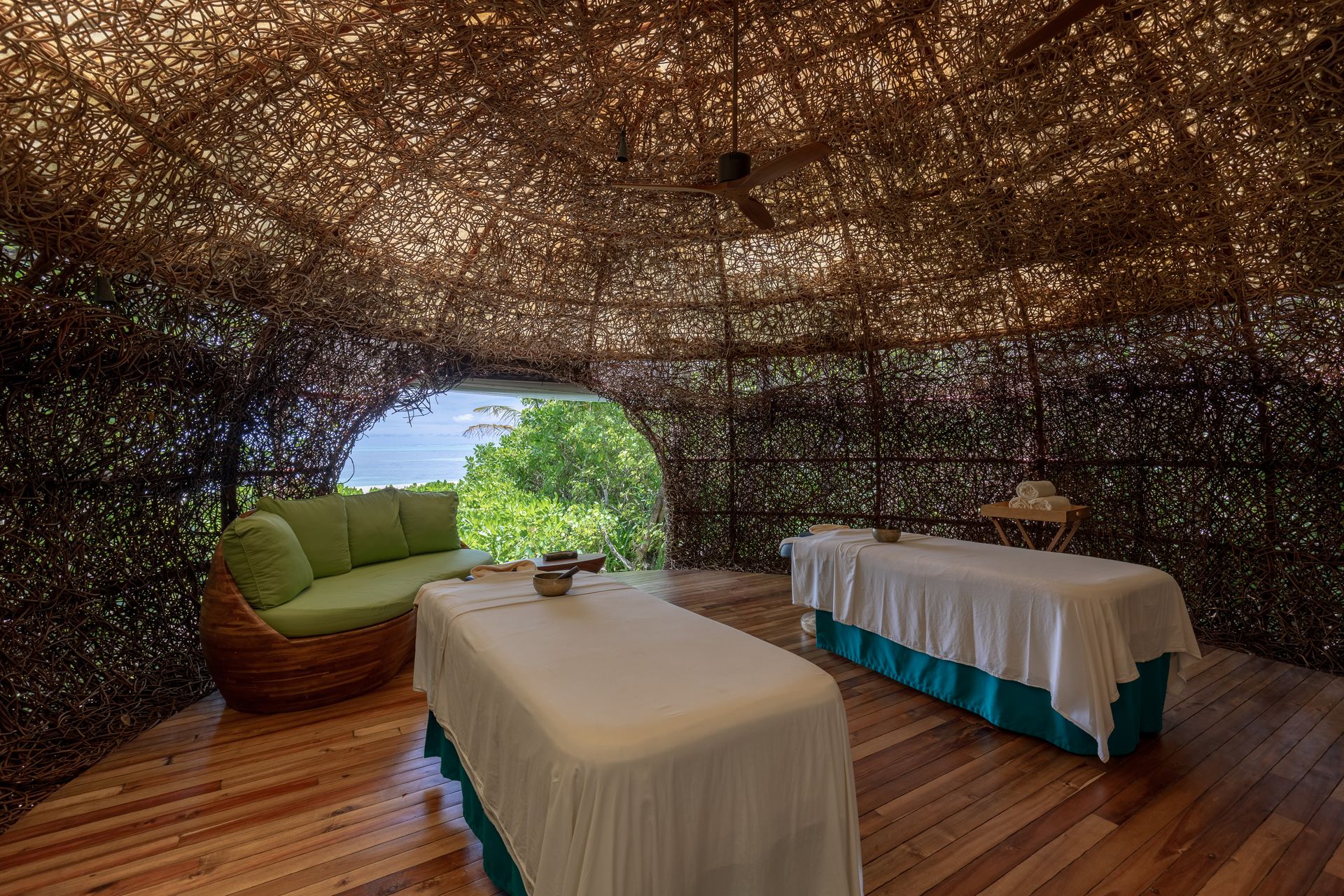 Spa treatment room inside a woven nest at Six Senses Laamu
