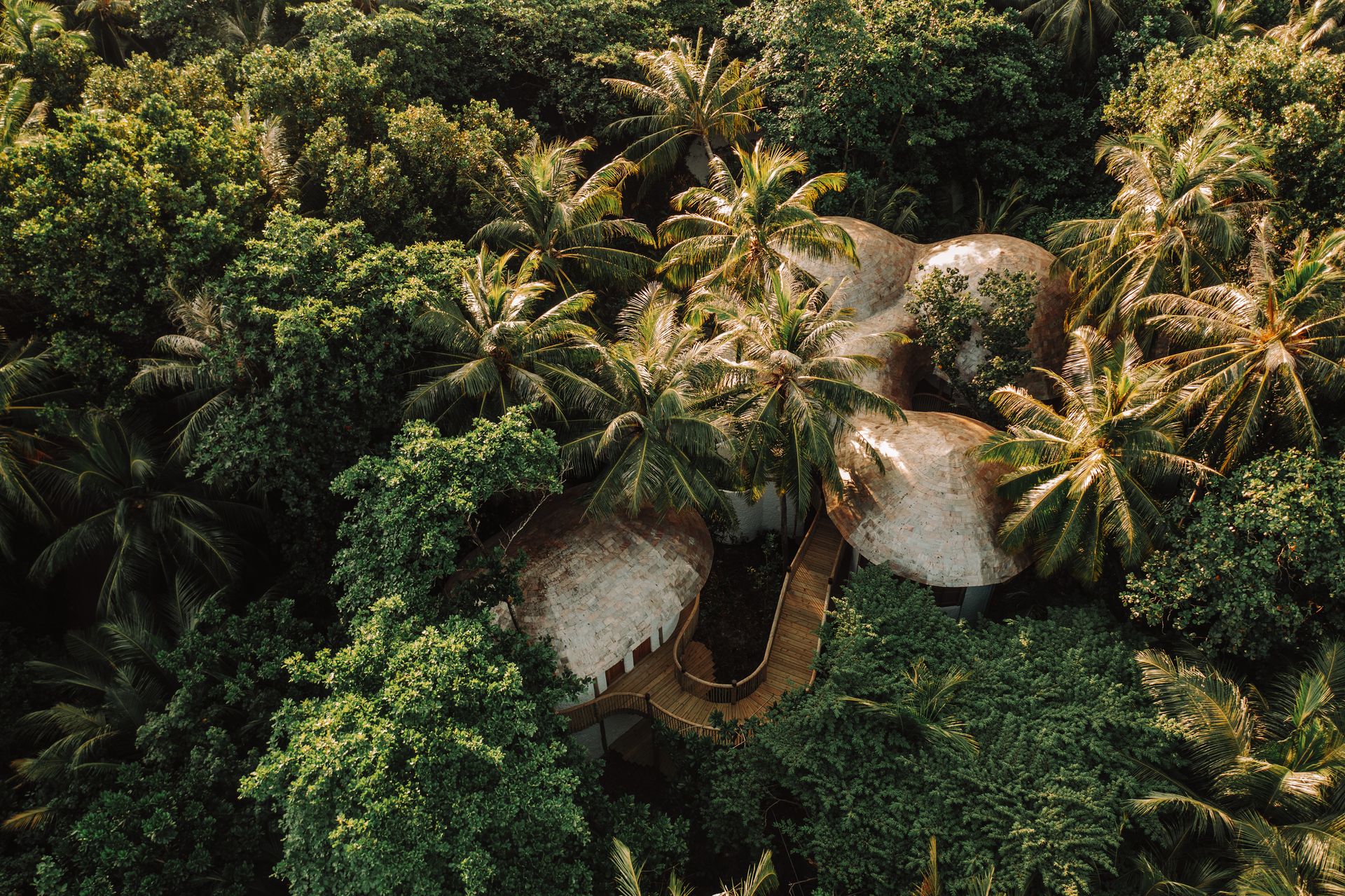 Soneva Soul spa among island trees, aerial view at Soneva Fushi