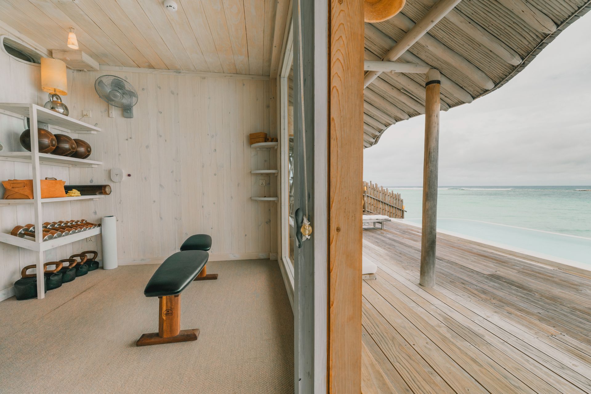 Villa pantry opening onto an oceanfront deck at Soneva Jani