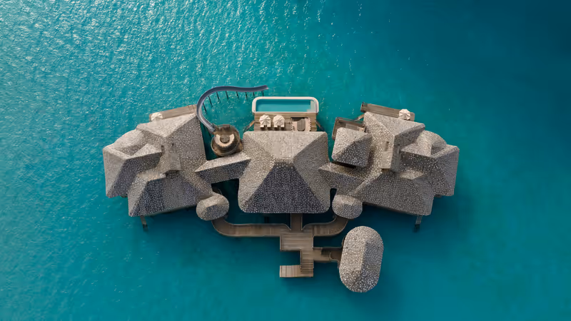Overwater residence surrounded by turquoise lagoon at Soneva Secret