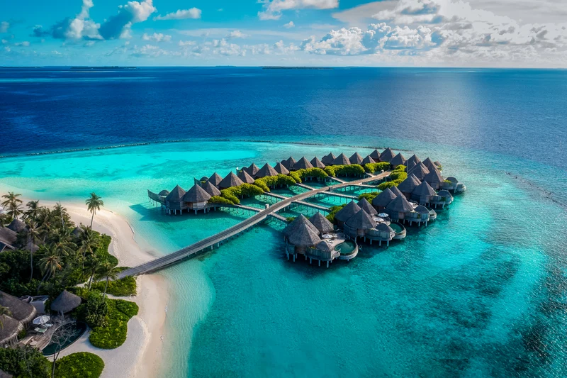 Island and water houses, aerial view at The Nautilus Maldives